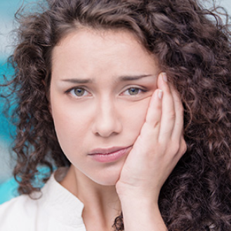 a lady in dental in pain