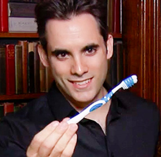 Michel Grandinetti holding a toothbrush