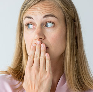 a lady covering her mouth